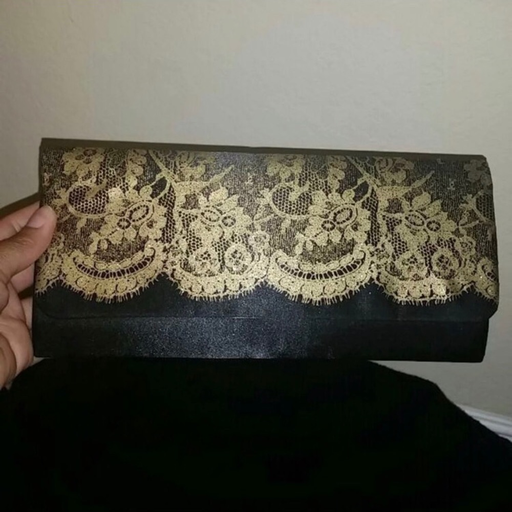 Beautiful back clutch with golden lace detail.